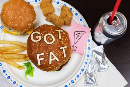 Juicy fast food burgers letters on a juicy burger. Unhealthy eating. Junk food concept.の写真素材