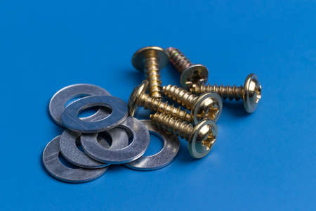 A black screw was isolated from golden screwsの写真素材