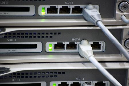 network devices with ethernet slots and RJ-45 cablesの写真素材