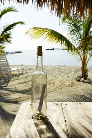 Message in a bottle on an isolated beachの写真素材