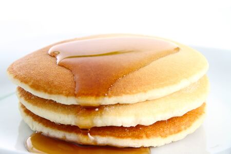 Short Stack of Pancakes with Syrup on White Background