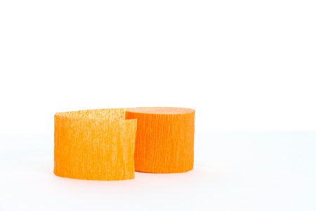Orange Crepe Paper Roll on a White Backgroundの写真素材