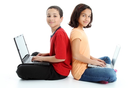 Picture of children on computer set on white backgroundの写真素材