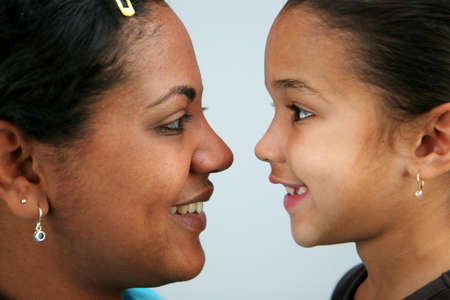 Mom and daughter smiling