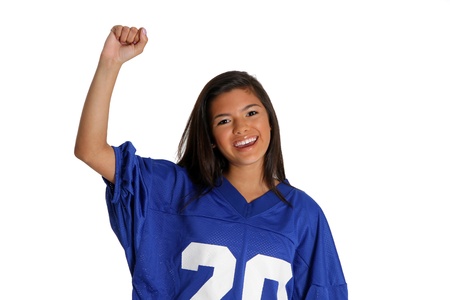 Teen cheering for her team in a jerseyの写真素材