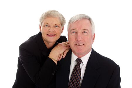 Senior Couple Set Against A White Background