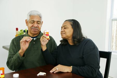 People getting ready to take their pillsの写真素材