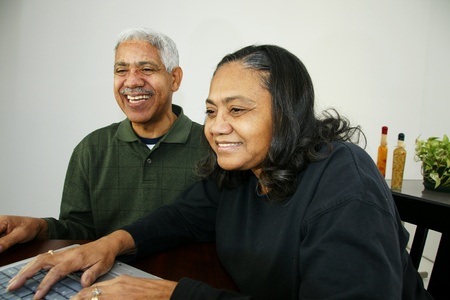 Family together inside their homeの写真素材