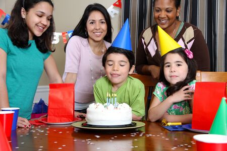 Group enjoying a birthday party for child