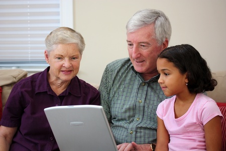 Grandparents together with their family at home