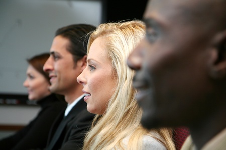 Business team sitting in a meeting at work