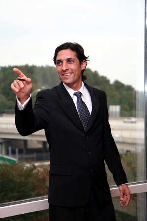 Businessman working in an office dressed in a suitの写真素材