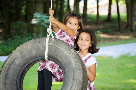 Sisters Outside Their Home In The Summerの写真素材
