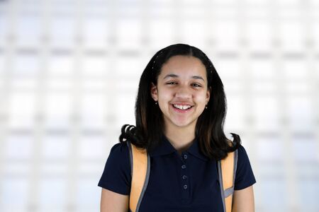 Girl with a backpack at her school