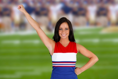 Cheerleader with uniform on at a football gameの写真素材