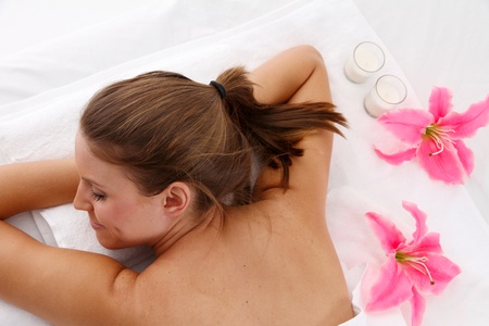Woman getting a getting relaxing massage in salonの写真素材