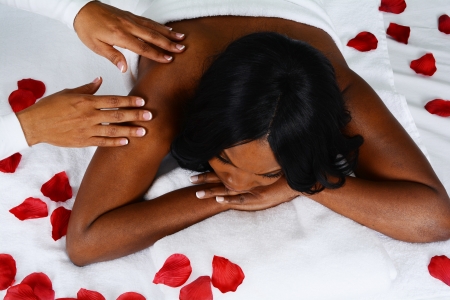 Woman getting a getting relaxing massage in salonの写真素材