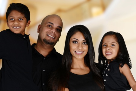 Family together inside of their new homeの写真素材