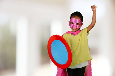 Girl who is dressed up as a super heroの写真素材