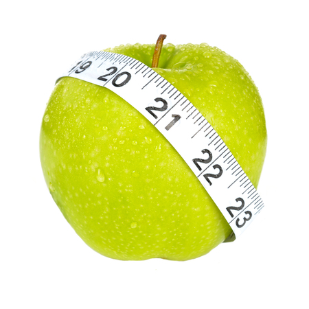 A delicious green apple ready to be eatenの写真素材