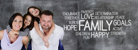 Young mother with her husband and daughtersの写真素材