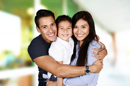 Young family together inside of their homeの写真素材