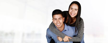 Man and woman posing together inside their homeの写真素材