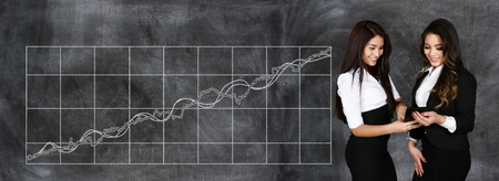 Confident businesswoman who is working at the stock marketの写真素材