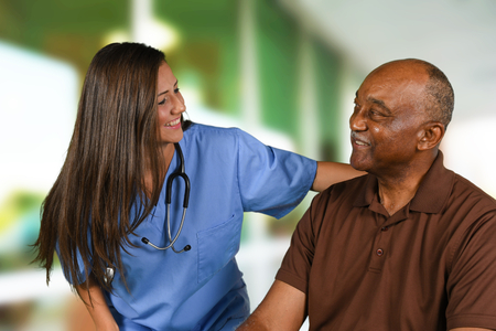 Health care worker helping an elderly patientの写真素材