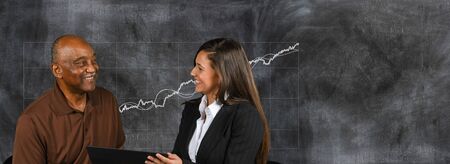 Businesswoman who is helping an elderly person plan their retirement