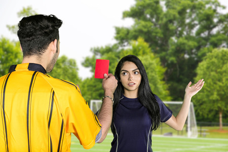 A soccer team playing a game outside