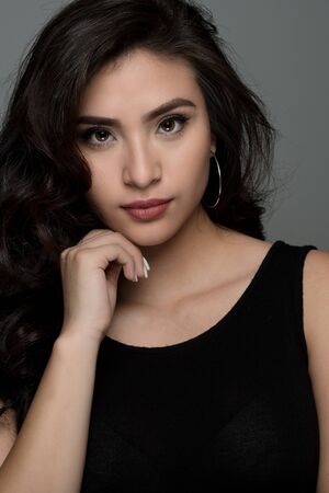 Portrait of a happy young hispanic womanの写真素材