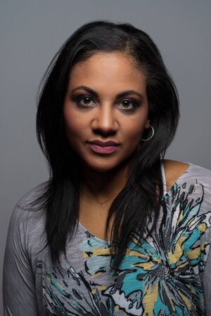 Portrait of a minority woman on solid background
