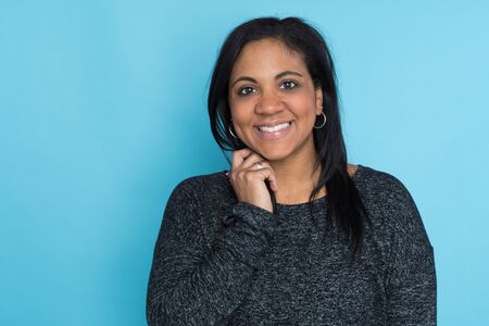 Portrait of a mother on a blue background