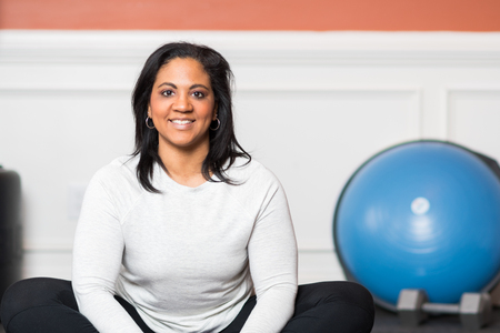 Woman working out in a gym at homeの写真素材