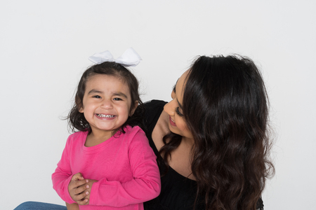 Happy young woman who is with her daughterの写真素材