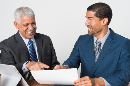 Group of two businessmen working together on a projectの写真素材