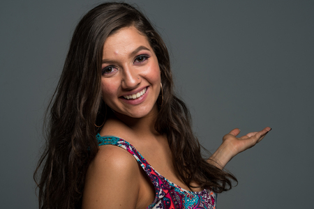 Beautiful hispanic mom posing for a portraitの写真素材