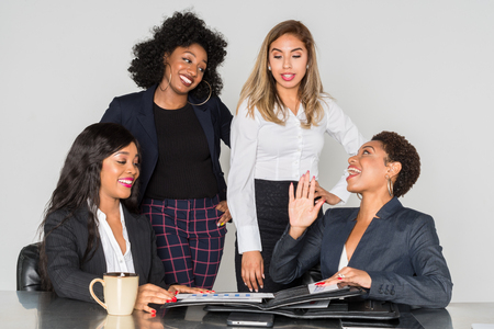 Group of businesswomen working together in an officeの写真素材