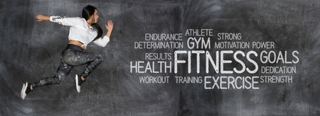 A young female athlete working out in trainingの写真素材