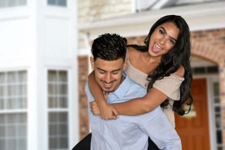A young happy hispanic couple smiling togetherの写真素材