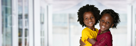 Group of two young african american girls who are sistersの写真素材