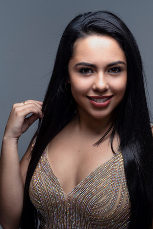 Young teenage hispanic fashion model posing in a studioの写真素材