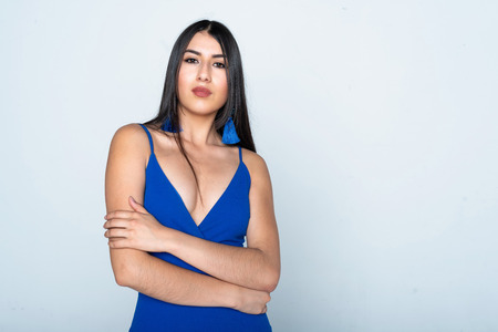 Young teen hispanic fashion model with a blue dressの写真素材