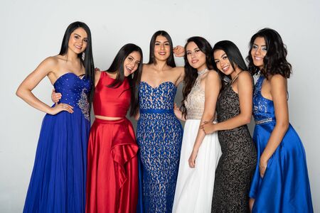 A group of young teen girls in dresses going to a prom danceの写真素材