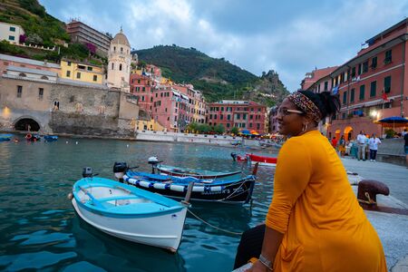 Woman enjoying a summer vacation in Cinque Terre Italy