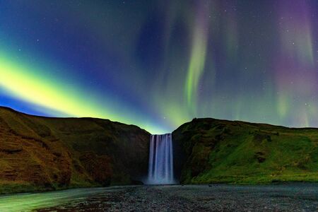 Northern Lights Aurora In Iceland set in the Skogafoss Waterfallの写真素材
