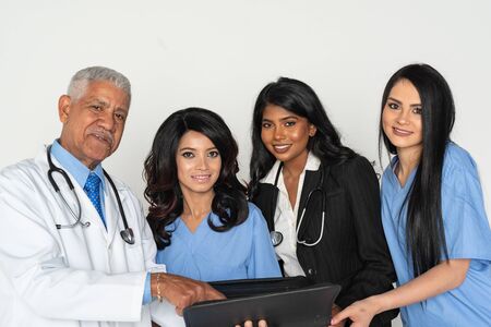 A group of minority doctors and nurses working at a hospitalの写真素材