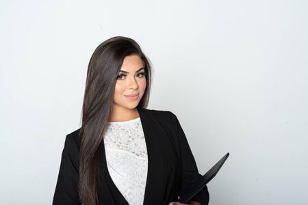 Portrait of a hispanic businesswoman working at her job in the officeの写真素材