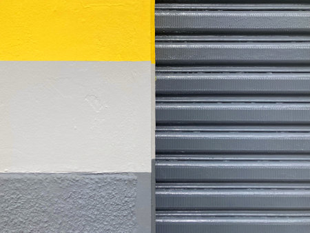 Yellow and gray roller shutter door with yellow and gray stripes background.の写真素材